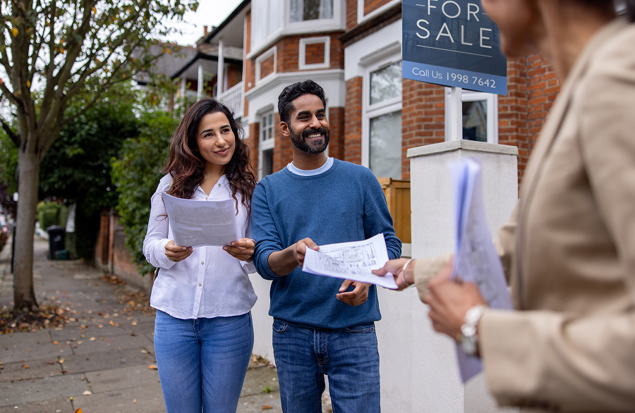 Couple viewing a house for sale